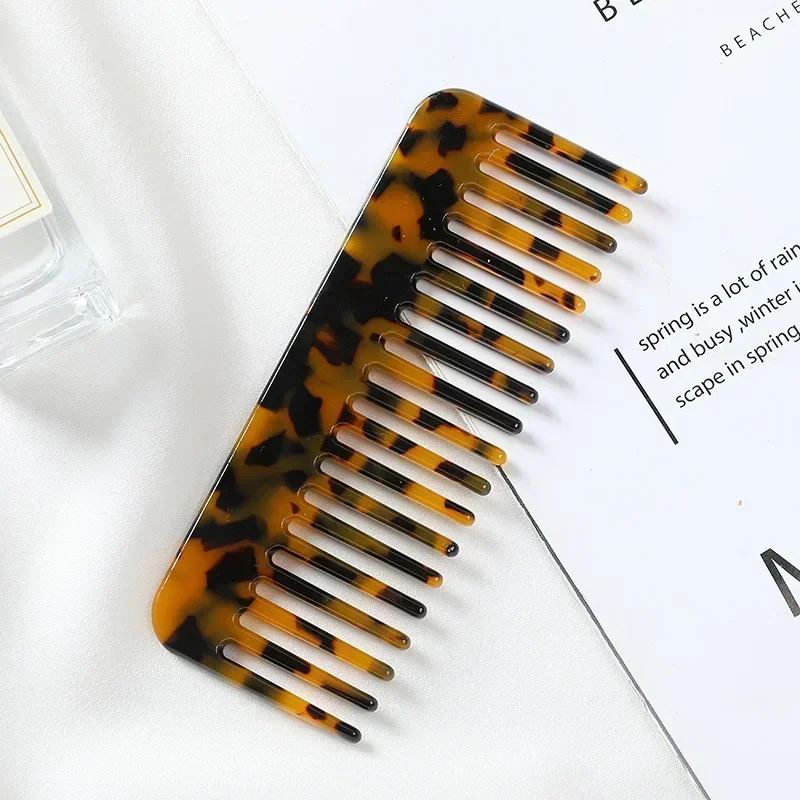 Brown and black tortoiseshell-pattern wide-tooth comb